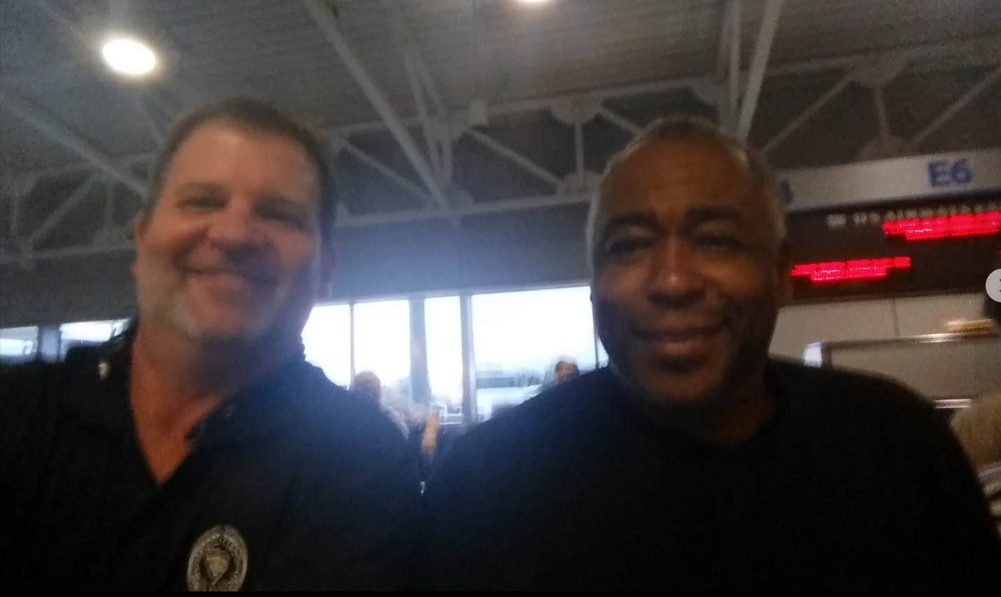 Gregg with John Saunders at the airport